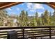 Deck view of mountain range and homes nestled in the trees at 4187 Matterhorn Way, Mount Charleston, NV 89124