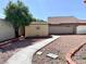 View of a backyard with an extra storage unit and a stone-covered area at 4210 Night Star St, Las Vegas, NV 89147