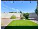 Artificial turf backyard with covered patio at 4210 Night Star St, Las Vegas, NV 89147