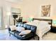 King-size bed, black leather couch, and serene decor at 4210 Night Star St, Las Vegas, NV 89147