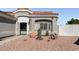 Landscaped front yard with a fountain and cacti at 4210 Night Star St, Las Vegas, NV 89147