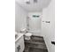 Clean bathroom with white tub and gray vinyl flooring at 4231 E Kellogg Rd, Pahrump, NV 89061