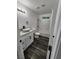 Modern bathroom with white vanity, vessel sink, and gray flooring at 4231 E Kellogg Rd, Pahrump, NV 89061