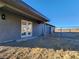 Back exterior with double doors and covered patio at 4231 E Kellogg Rd, Pahrump, NV 89061