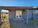 Back exterior with double doors and covered patio at 4231 E Kellogg Rd, Pahrump, NV 89061