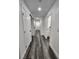 Bright hallway with wood-look floors and white doors at 4231 E Kellogg Rd, Pahrump, NV 89061