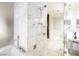 Elegant bathroom with marble walls and a walk-in shower at 4381 W Flamingo Rd # 28316, Las Vegas, NV 89103