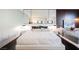 Modern bedroom with a large bed, mirrored wall, and stylish decor at 4381 W Flamingo Rd # 28316, Las Vegas, NV 89103