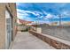 Backyard patio with shade sail and block wall at 4496 Arlington Park Ct, Las Vegas, NV 89110