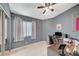 Bedroom with a desk, window, and gray walls at 4496 Arlington Park Ct, Las Vegas, NV 89110