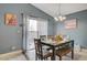 Bright dining room features a table with six chairs and access to the backyard at 4496 Arlington Park Ct, Las Vegas, NV 89110