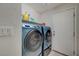 Laundry room with washer, dryer, and shelving at 4496 Arlington Park Ct, Las Vegas, NV 89110