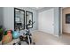 Home gym featuring an exercise bike, yoga mats, and mirrors at 5012 Notting Hill Ave, Las Vegas, NV 89139