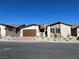 Single-story home with brown garage door and desert landscaping at 5012 Notting Hill Ave, Las Vegas, NV 89139