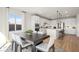 Spacious eat-in kitchen with a large island, white cabinetry, and modern pendant lighting at 5012 Notting Hill Ave, Las Vegas, NV 89139