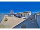 Large backyard with gravel landscaping and covered patio at 5020 Valero Ct, Pahrump, NV 89060