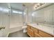 Clean bathroom with tub, wood vanity and tiled floor at 5020 Valero Ct, Pahrump, NV 89060