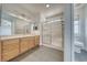 Bathroom with wood cabinets, tiled floors and shower at 5020 Valero Ct, Pahrump, NV 89060