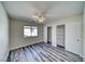 Bedroom with wood-look floors, ceiling fan and closet at 5020 Valero Ct, Pahrump, NV 89060