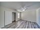 Bedroom with closet, wood-look floors and ceiling fan at 5020 Valero Ct, Pahrump, NV 89060