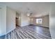 Spacious living room with wood-look flooring and ceiling fan at 5020 Valero Ct, Pahrump, NV 89060