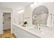 Double vanity bathroom with marble counters and gold fixtures at 5201 Rim View Ln, Las Vegas, NV 89130