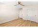 Light and bright bedroom with ceiling fan and wood floors at 5201 Rim View Ln, Las Vegas, NV 89130