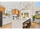 Modern kitchen featuring white cabinets, quartz countertops, and stainless steel appliances at 5201 Rim View Ln, Las Vegas, NV 89130