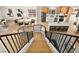 Open staircase overlooking the kitchen and living areas at 5201 Rim View Ln, Las Vegas, NV 89130