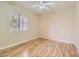 Spacious bedroom with hardwood floors and ceiling fan at 5250 S Rainbow Blvd # 2056, Las Vegas, NV 89118