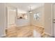 Dining area with hardwood floors and adjacent kitchen at 5250 S Rainbow Blvd # 2056, Las Vegas, NV 89118