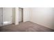 Bedroom featuring neutral walls, gray carpet, and closet with sliding doors at 5391 Kennedy Hill Ave, Las Vegas, NV 89139