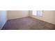 Spacious bedroom with plush carpet and large window at 5391 Kennedy Hill Ave, Las Vegas, NV 89139