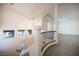 Bright foyer with tile flooring, chandelier, and decorative wrought iron railing at 5391 Kennedy Hill Ave, Las Vegas, NV 89139