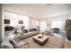 Bright, open-concept living room flows into the kitchen, perfect for modern living and entertaining at 5391 Kennedy Hill Ave, Las Vegas, NV 89139