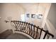 Foyer staircase features wrought iron railing, carpeted stairs, and natural light at 5391 Kennedy Hill Ave, Las Vegas, NV 89139