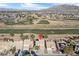 Aerial view showing home location near golf course and mountain backdrop at 5458 Walton Heath Ave, Las Vegas, NV 89142