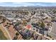 Aerial view showcasing home's location near a golf course and residential area at 5458 Walton Heath Ave, Las Vegas, NV 89142