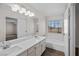 Bathroom featuring a bathtub, double vanity and window at 5458 Walton Heath Ave, Las Vegas, NV 89142