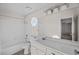 Bathroom boasts a vanity with quartz countertop at 5458 Walton Heath Ave, Las Vegas, NV 89142