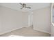 Bright bedroom featuring a ceiling fan and carpet at 5458 Walton Heath Ave, Las Vegas, NV 89142