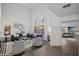 Virtually staged living room with high ceilings and hardwood floors at 5458 Walton Heath Ave, Las Vegas, NV 89142