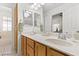 Double vanity bathroom with a large mirror and separate tub at 5608 Port Barrington Way, Las Vegas, NV 89130