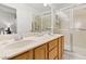 Bright bathroom boasts double sinks, shower, and ample storage at 5608 Port Barrington Way, Las Vegas, NV 89130