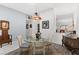 Elegant dining room featuring a glass-top table and hardwood floors at 5608 Port Barrington Way, Las Vegas, NV 89130