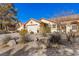 House exterior with landscaping and driveway at 5608 Port Barrington Way, Las Vegas, NV 89130