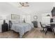 Main bedroom with a king-size bed, ample natural light, and an adjacent workspace at 5608 Port Barrington Way, Las Vegas, NV 89130