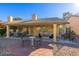 Relaxing patio area with seating and table at 5608 Port Barrington Way, Las Vegas, NV 89130