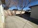 This side yard features ample space for potential gardening or outdoor activities at 619 Brush St, Las Vegas, NV 89107