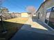 This spacious yard features lawn, extra storage, and plenty of concrete at 619 Brush St, Las Vegas, NV 89107